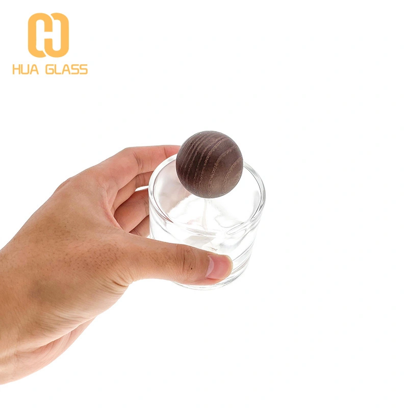 50 مل 100 مل زجاجة عطر زجاجية صغيرة مستديرة مع غطاء خشبي مستدير