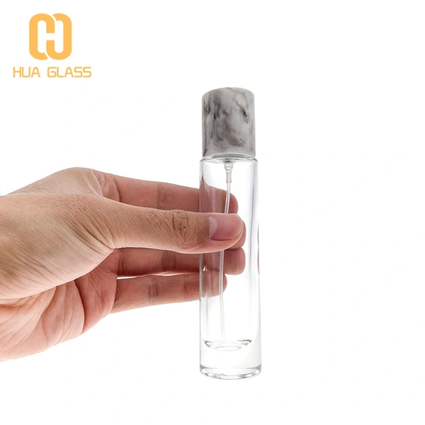 Frasco de perfume cilíndrico de 30 ml con tapa de mármol gris rosa