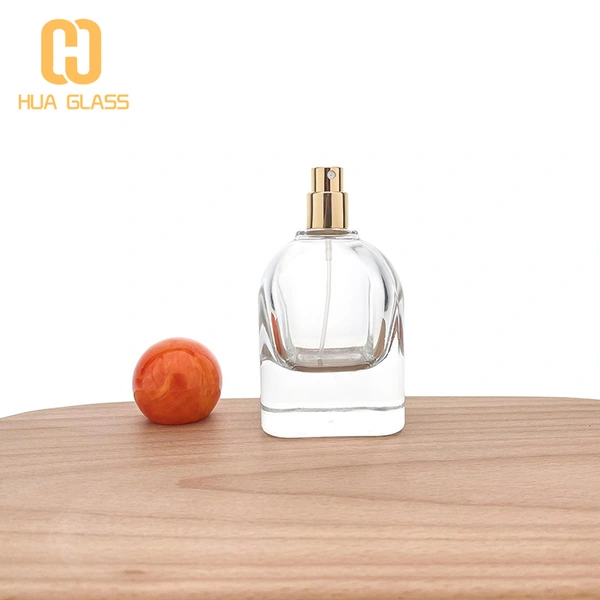 Botella de perfume de vidrio vacía personalizada de 80 ml con tapa de bola de resina