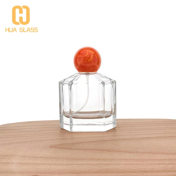 China supplier 100ml glass perfume bottle with resin ball cap 