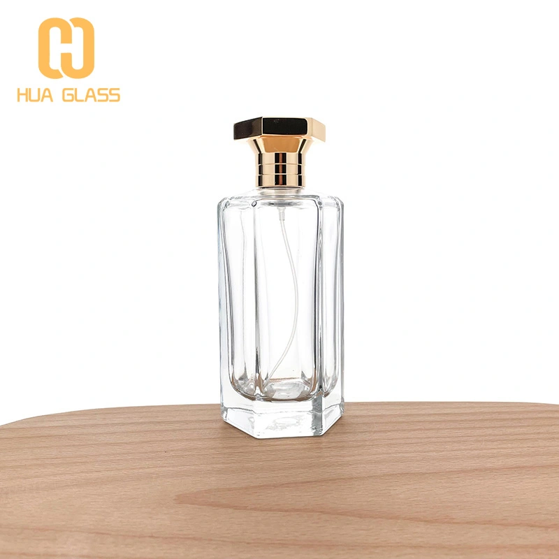 Frasco de perfume con tapa de zamak de vidrio transparente en forma de octágono de 100 ml
