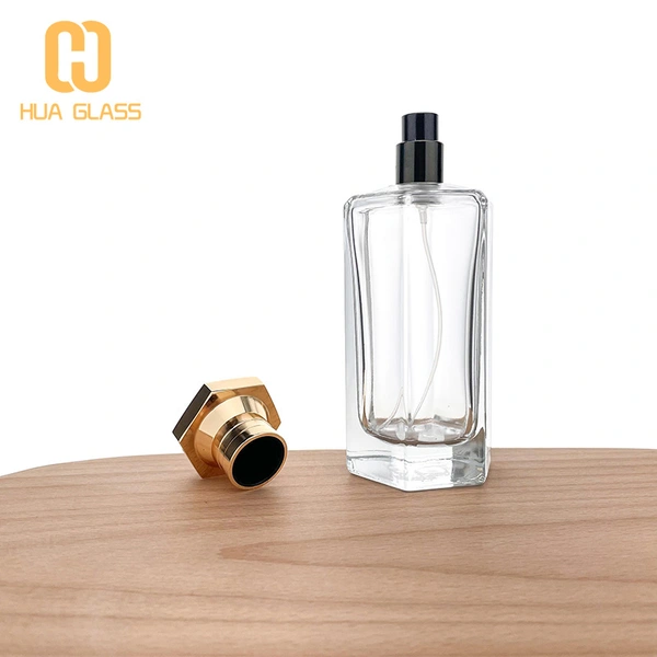 Frasco de perfume con tapa de zamak de vidrio transparente en forma de octágono de 100 ml