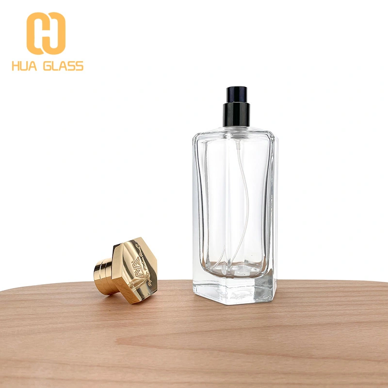 Frasco de perfume con tapa de zamak de vidrio transparente en forma de octágono de 100 ml