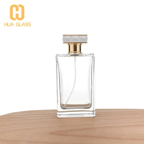 Frasco de perfume de vidrio rectangular de 100 ml con tapa de aleación de zinc metálico  