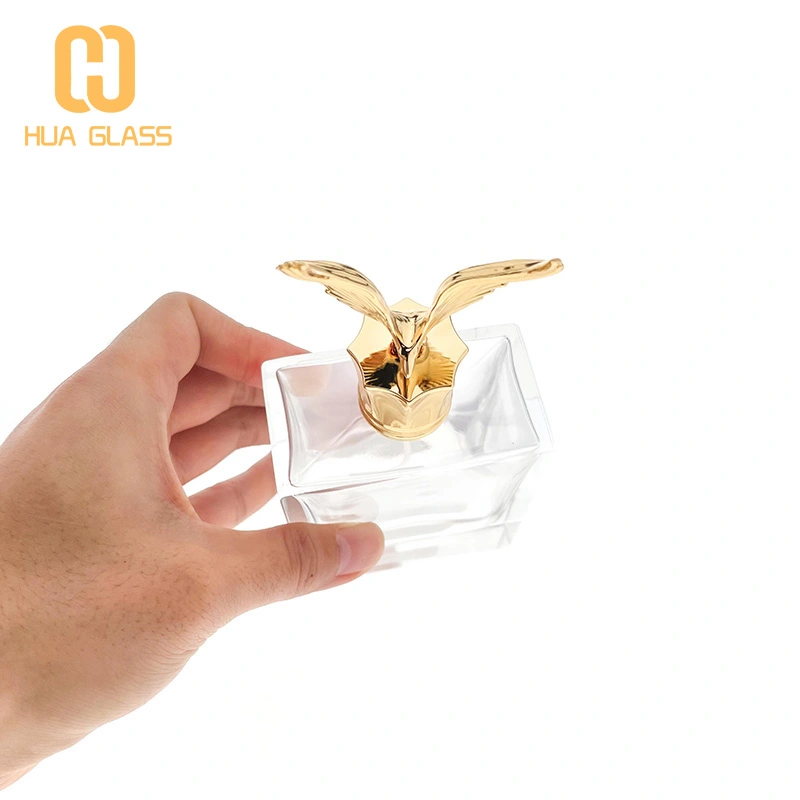 Frasco de perfume con tapa de zamak en forma de águila de vidrio pulido a mano cuadrado de 100 ml  
