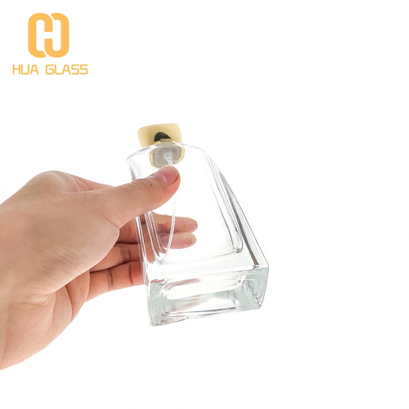 botella de perfume personalizada botella de perfume de vidrio en aerosol de 100 ml con tapa de zamak  