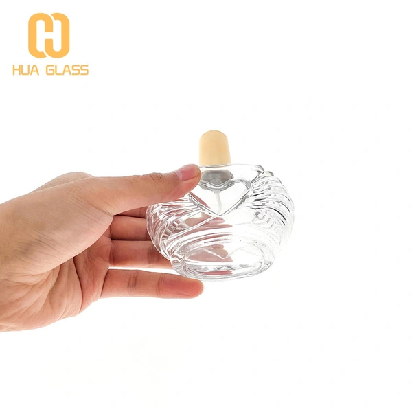 Botella de perfume única de 100 ml con bomba