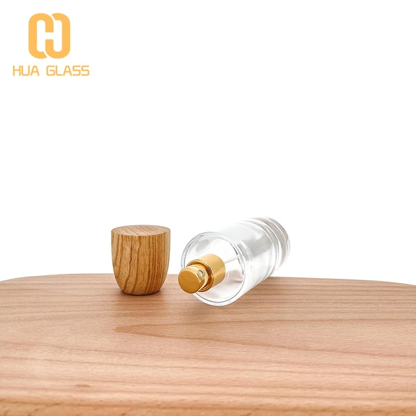 Tapa de madera personalizada 50ml 100ml botella de perfume de vidrio redonda cilíndrica