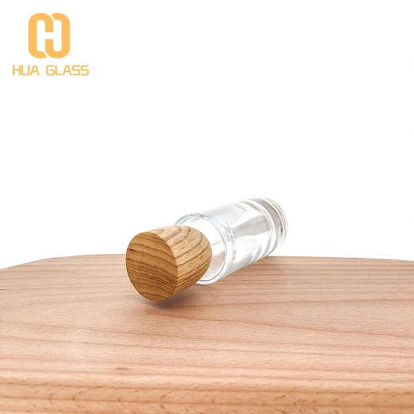 Tapa de madera personalizada 50ml 100ml botella de perfume de vidrio redonda cilíndrica