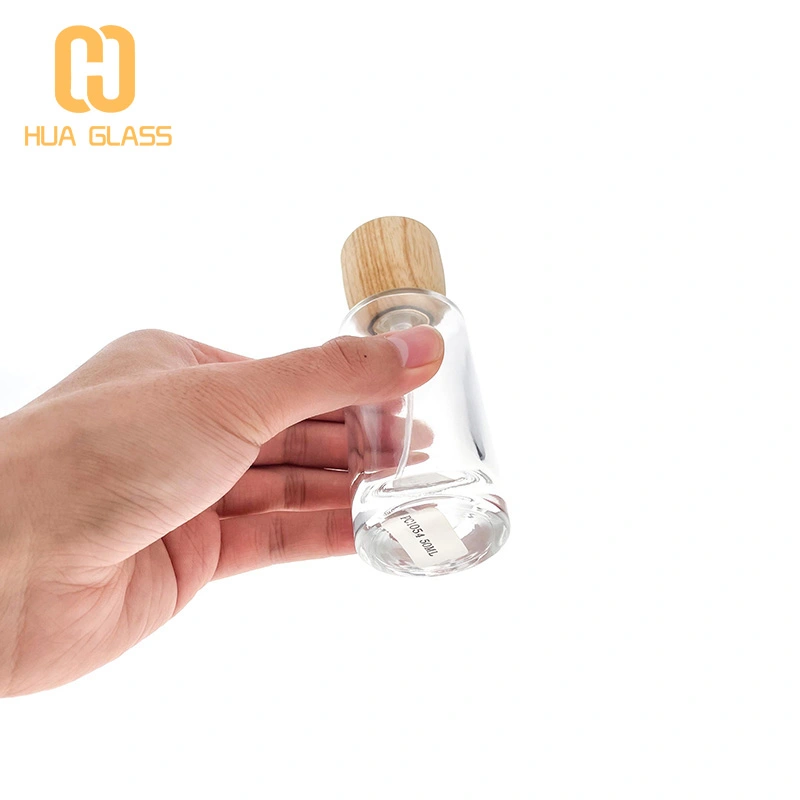Tapa de madera personalizada 50ml 100ml botella de perfume de vidrio redonda cilíndrica  