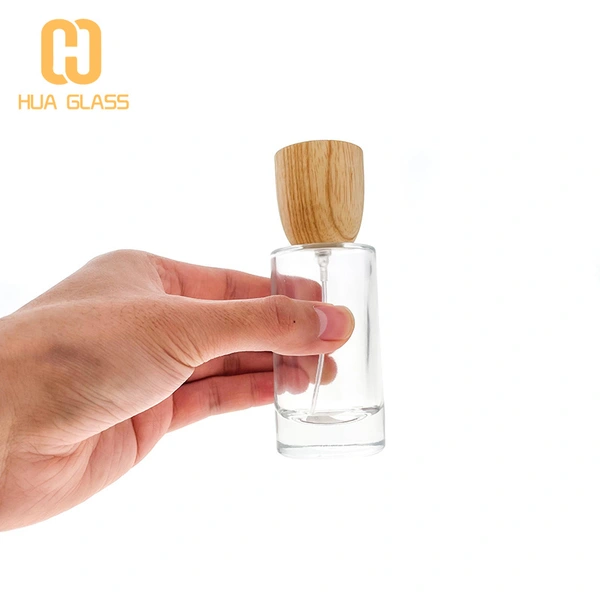Tapa de madera personalizada 50ml 100ml botella de perfume de vidrio redonda cilíndrica