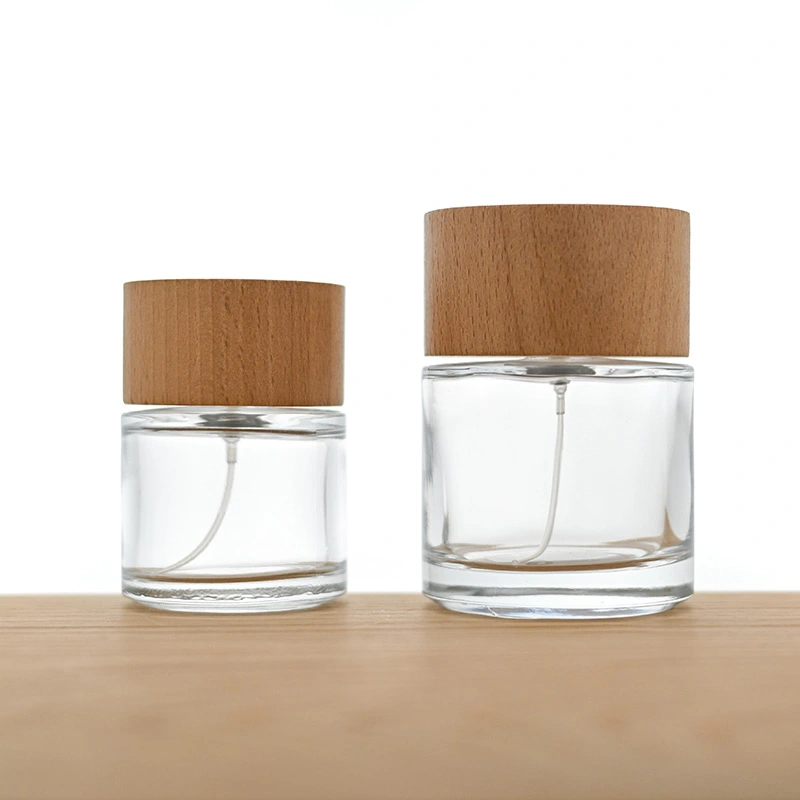 Frasco de perfume redondo de vidrio de 50 ml y 100 ml con tapa de madera  