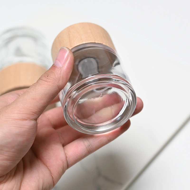 Frasco de perfume redondo de vidrio de 50 ml y 100 ml con tapa de madera  