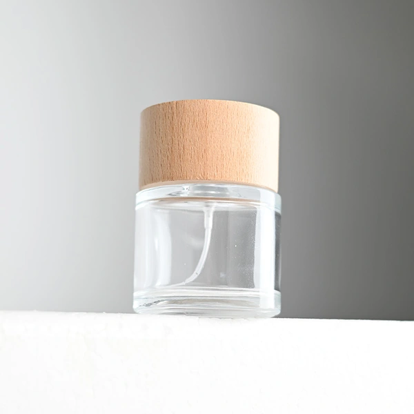 Frasco de perfume redondo de vidrio de 50 ml y 100 ml con tapa de madera