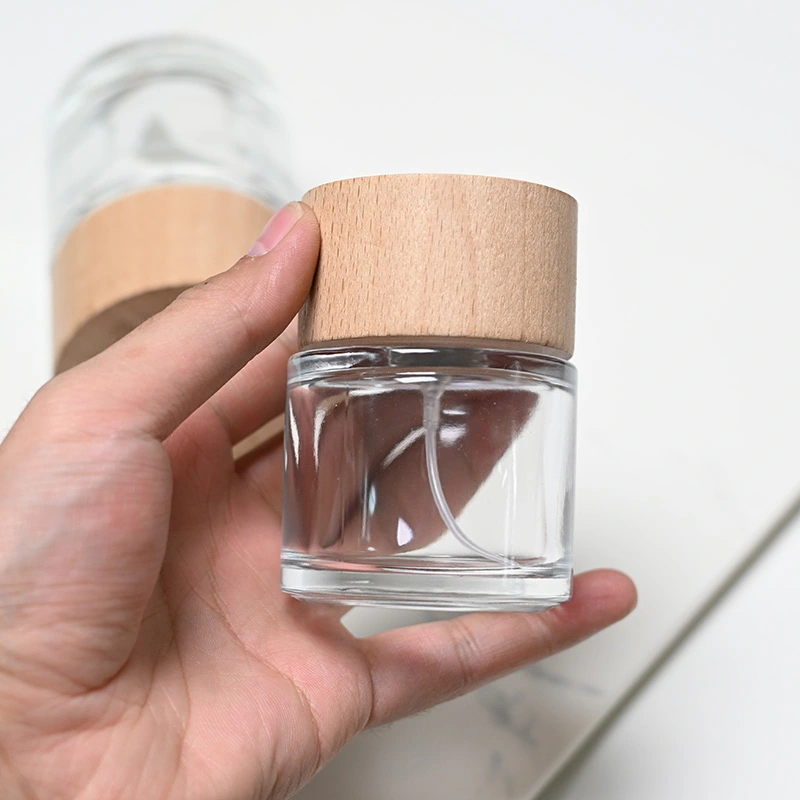 Frasco de perfume redondo de vidrio de 50 ml y 100 ml con tapa de madera  