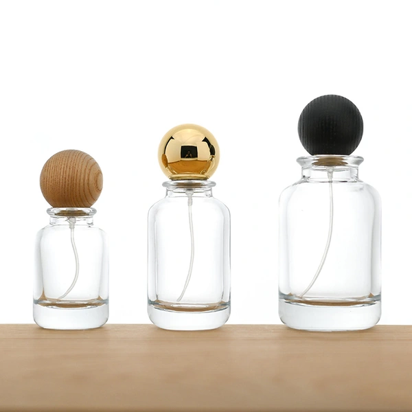 Venta al por mayor botella de perfume redonda de vidrio de 30 50 100 ml con tapa de bola