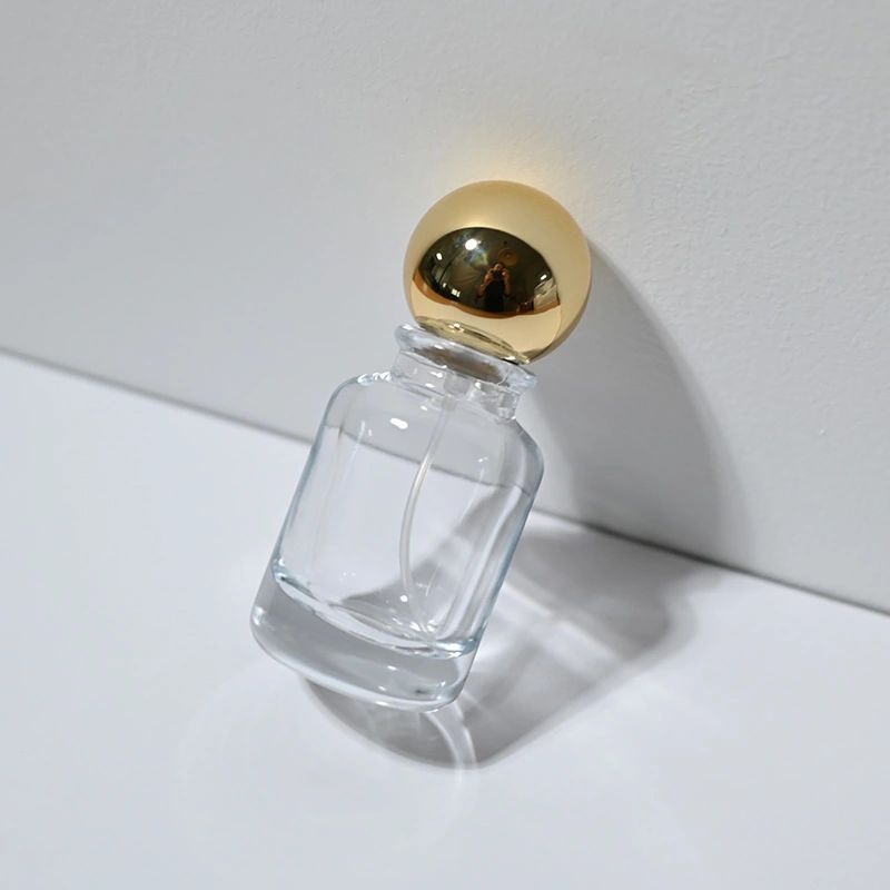 Venta al por mayor botella de perfume redonda de vidrio de 30 50 100 ml con tapa de bola  