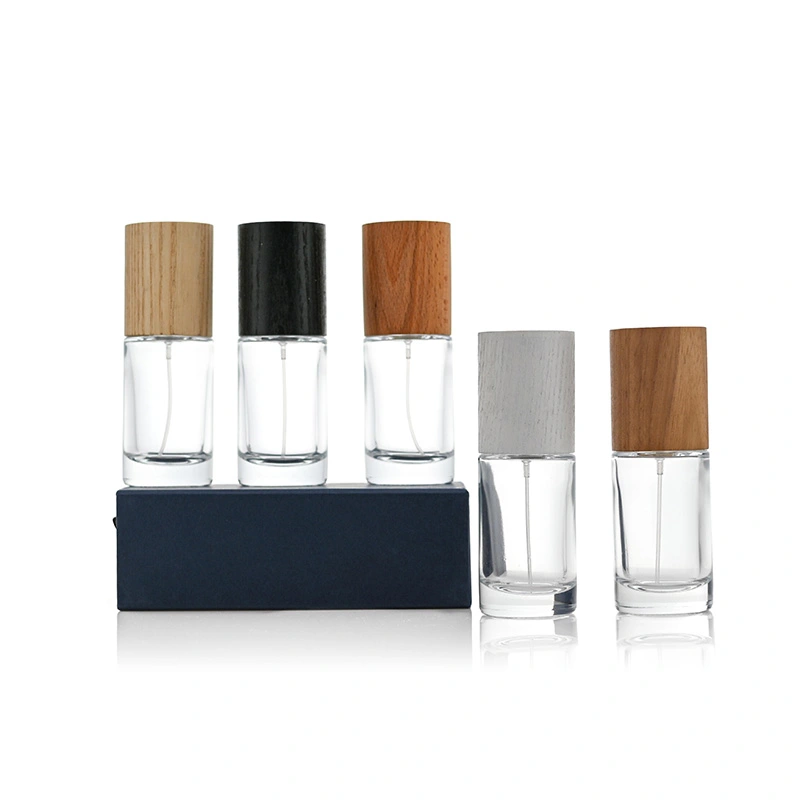Frasco de perfume redondo cilíndrico de 50 ml con tapa de madera  