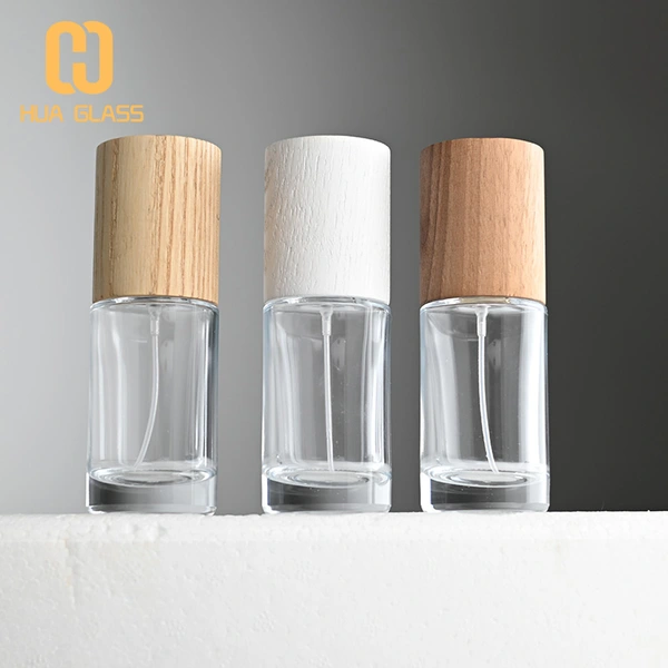 Frasco de perfume redondo cilíndrico de 50 ml con tapa de madera