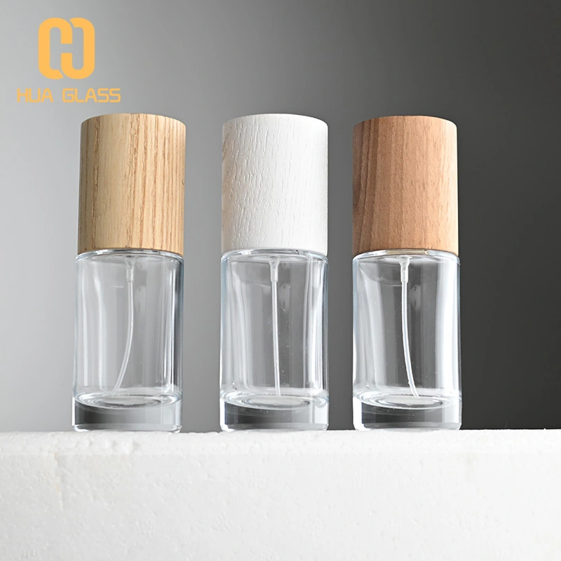 Frasco de perfume redondo cilíndrico de 50 ml con tapa de madera  