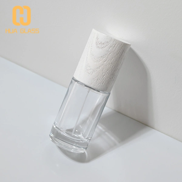 Frasco de perfume redondo cilíndrico de 50 ml con tapa de madera