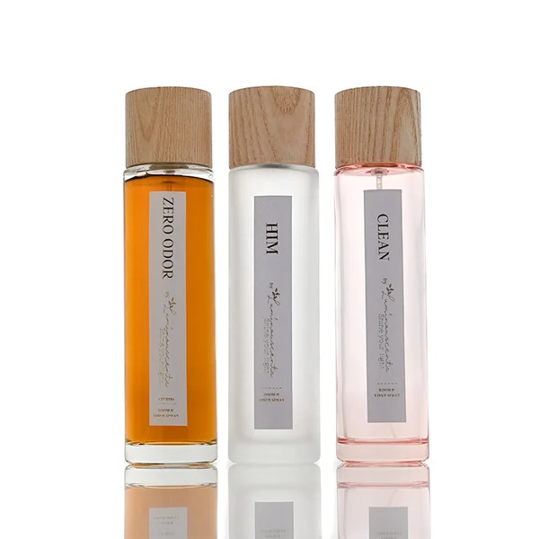 Frasco de perfume rectangular de vidrio de 60 ml, 80 ml, 100 ml con tapa de piedra dorada