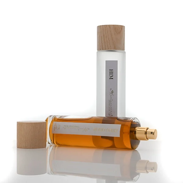 Frasco de perfume rectangular de vidrio de 60 ml, 80 ml, 100 ml con tapa de piedra dorada