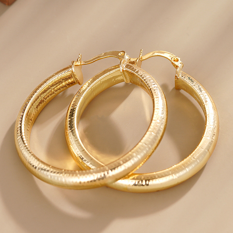 Middle Eastern hot-selling earrings for women with striped metal texture accessories, manufacturers of European and American new styles