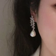 Celebrity temperament horse eye leaf earrings female teardrop-shaped imitation pearl jewelry light luxury fairy lady earrings