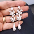 Gentle temperament long earrings flower imitation pearl high-end leaf water drop French earrings wholesale