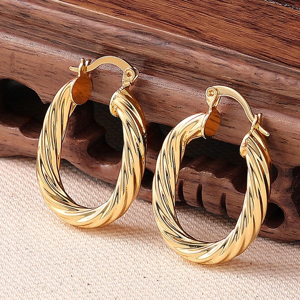 Middle Eastern factory direct sales earrings for women, U-shaped spiral niche accessories, Maillard super hot style
