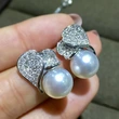   New exquisite leaf earrings imitation pearl magazine style temperament accessories fashion design earrings