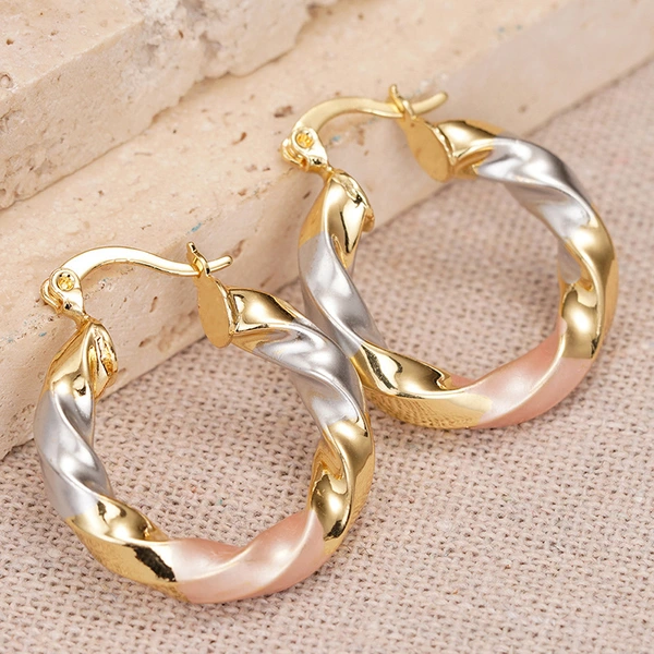 Japanese and Korean gentle style spiral earrings for women metal painting oil three-color jewelry holiday style popular jewelry