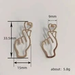 Simple hollow heart earrings for women, personalized European and American exaggerated metal earrings, gesture temperament earrings