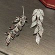 Micro-inlaid zircon shiny leaf earrings for women, exquisite temperament plant long earrings, popular in Europe and America