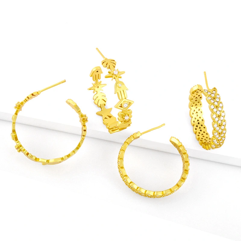 Clearance European and American creative micro-inlaid zircon C-shaped earrings eyes smile palm leaves splicing geometric earrings erx09