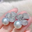 Clover imitation pearl earrings for women, fashionable, exquisite and shining earrings, light luxury style, high-end small fragrance style earrings