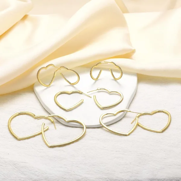 AS jewelry European and American new copper plated 18k gold love heart-shaped hollow zircon earrings earrings erz90