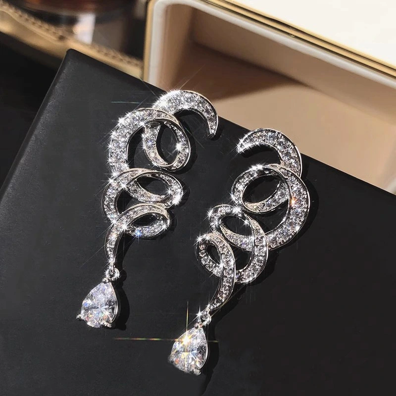  European and American cross-geometric line earrings for women inlaid with zircon, sparkling water drop design earrings for banquets, light luxury style