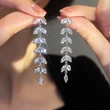  New arrival tassel leaf earrings for women, super long chain, geometric earrings inlaid with zircon, hot sale