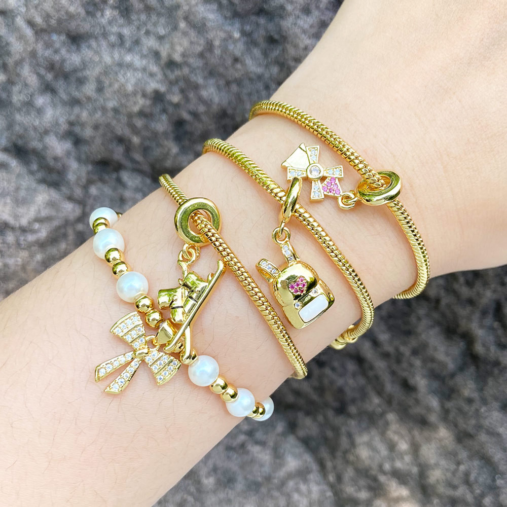 AS jewelry European and American bow bag pendant bracelet female gold-plated love pearl hand jewelry bracelet bre32