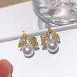 New imitation pearl leaf earrings for women, daily wear, ladies' accessories, fashionable, elegant and light luxury style