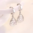 European and American silver-plated earrings imitating moonlight cat's eye stone totem ear clip earrings female wishing pool earrings ear jewelry