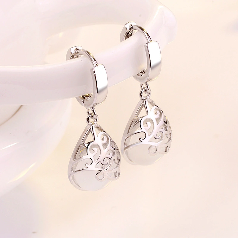 European and American silver-plated earrings imitating moonlight cat's eye stone totem ear clip earrings female wishing pool earrings ear jewelry