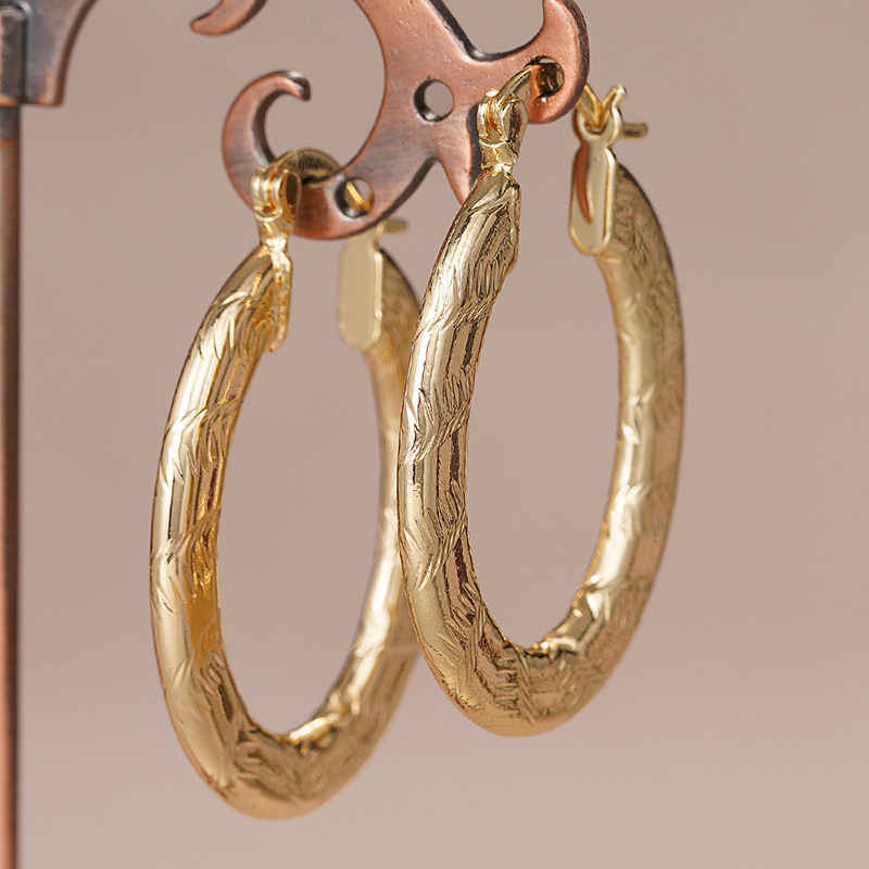 Pinduoduo Middle East hot-selling earrings for women, U-shaped dark pattern carved jewelry, Maillard style jewelry