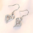  2024 new style trendy heart earrings Korean temperament long style net red earrings round face slimming earrings