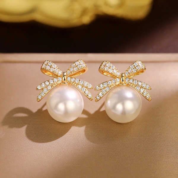 Bowknot diamond imitation pearl female earrings French retro exquisite earrings Japanese and Korean light luxury earrings
