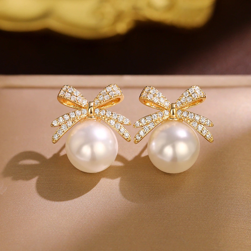 Bowknot diamond imitation pearl female earrings French retro exquisite earrings Japanese and Korean light luxury earrings