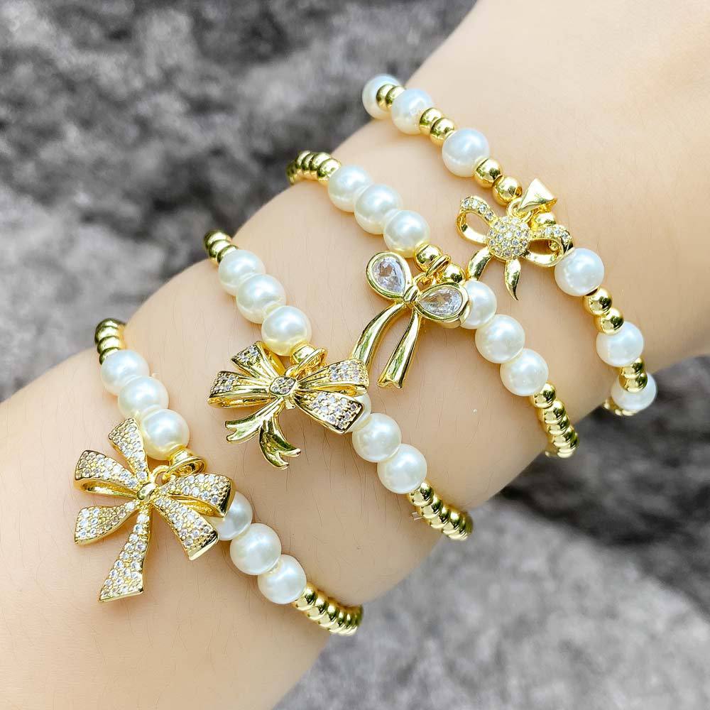 AS jewelry hot selling bow pendant bracelet female gold-plated zircon pearl bracelet bre53