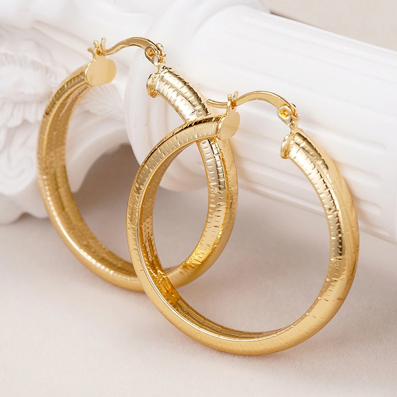 Middle Eastern hot-selling earrings for women with striped metal texture accessories, manufacturers of European and American new styles